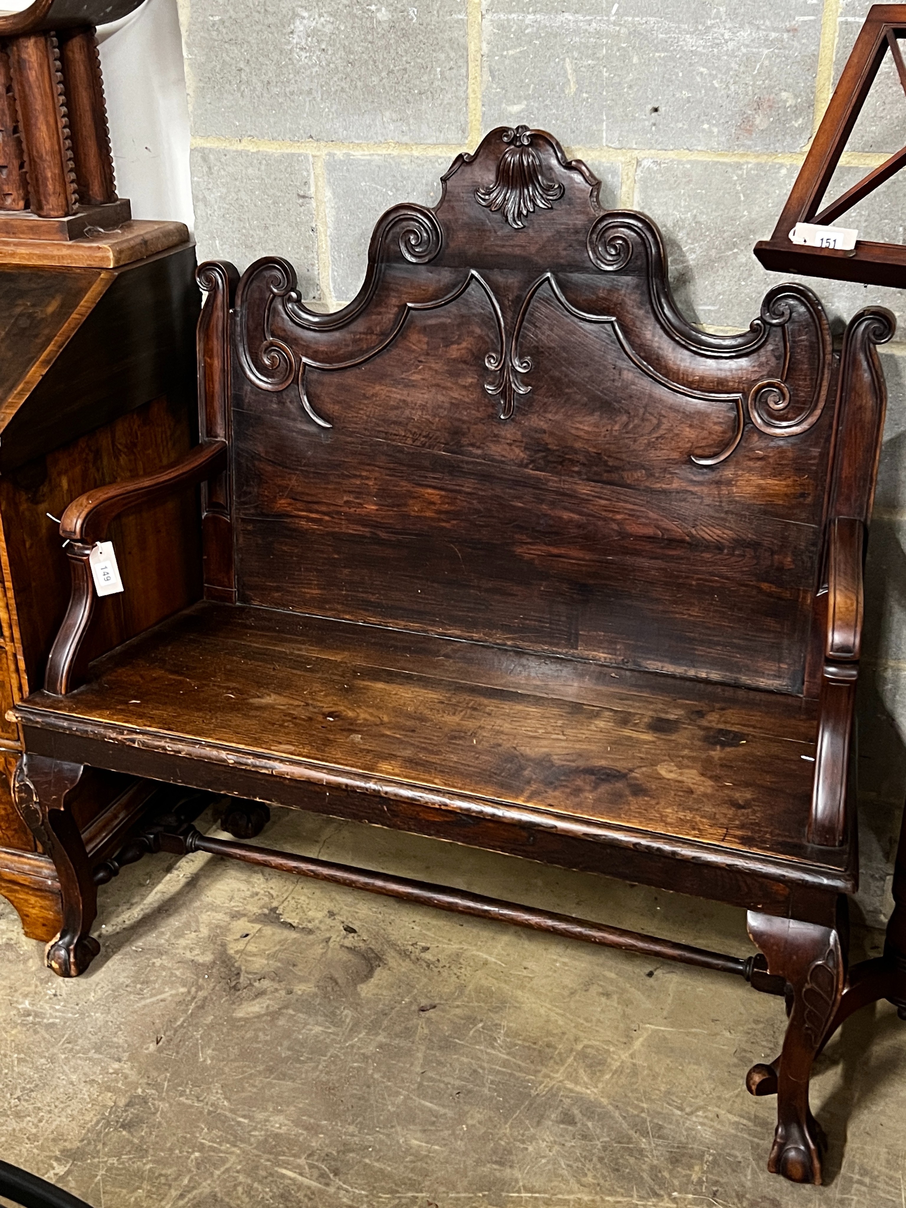 A Portuguese carved oak and fruitwood settle, width 116cm, depth 50cm, height 118cm